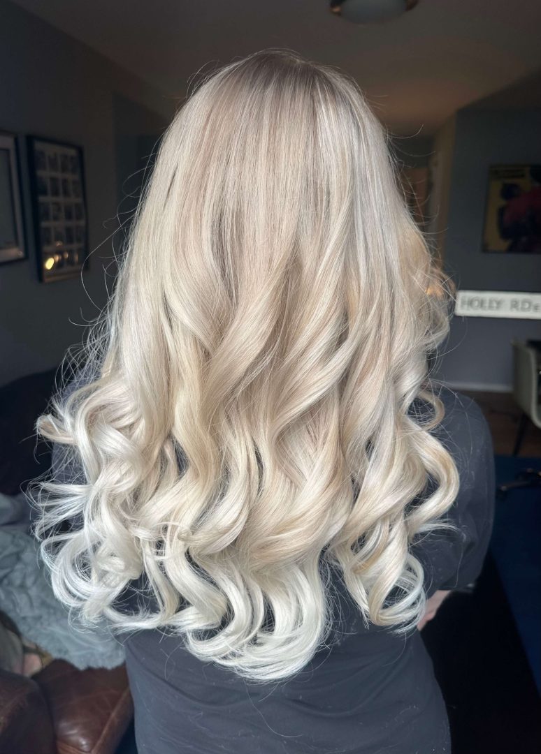 Hair looking gorgeous after a balayage and curl